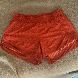 Athleta orange running shorts in medium